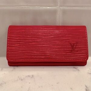 Authentic new condition Louis Vuitton epi red key ring holder